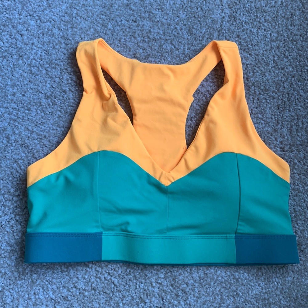 Fabletics green and yellow sports bra. Medium hold with padding.